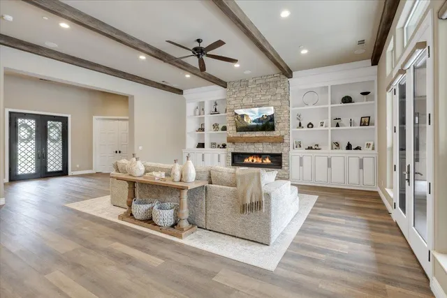 a kitchen with a dining table chairs and white appliances