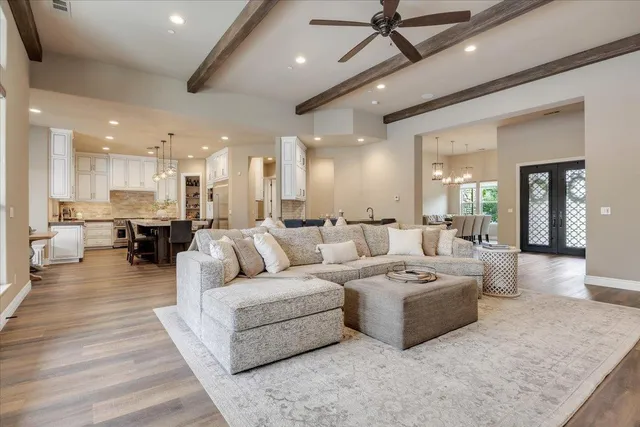 a large kitchen with a table and chairs