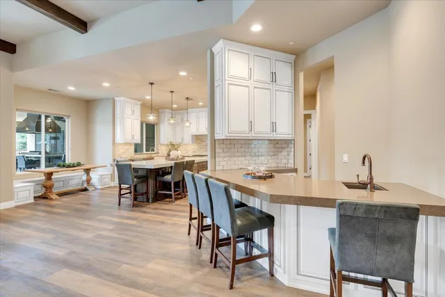 a kitchen with granite countertop cabinets stainless steel appliances and a window