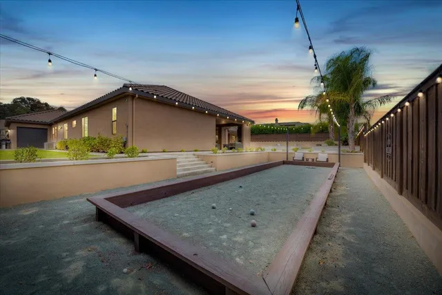 a view of a dining room with furniture wooden floor and chandelier