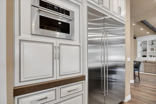a bathroom with a granite countertop sink a toilet and a mirror