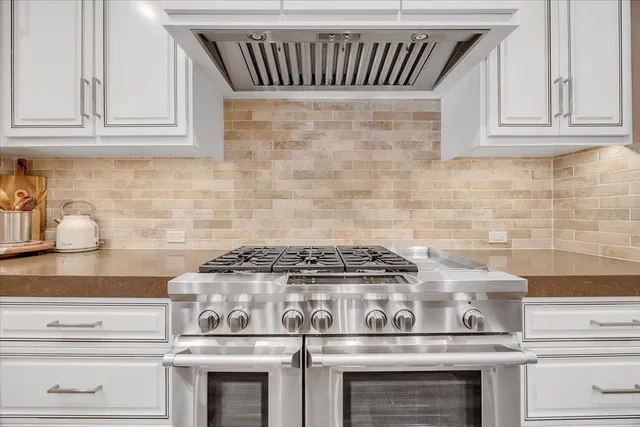 a spacious bathroom with a double vanity sink a mirror and a shower