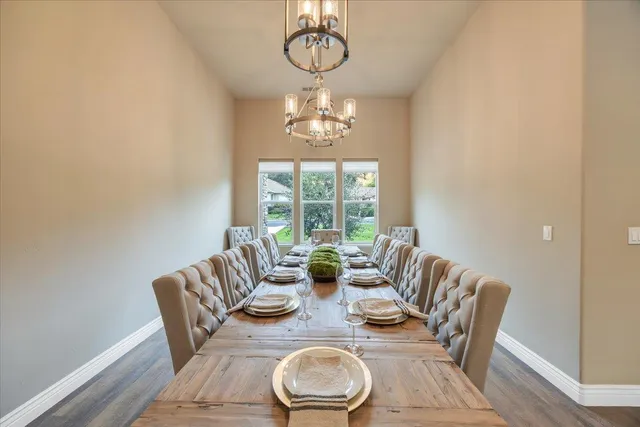 a view of walk in closet with clothes shoes and a large window