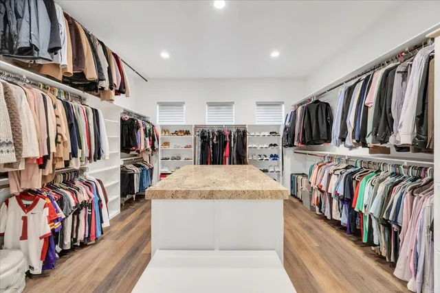 a kitchen with stainless steel appliances granite countertop a sink and a stove