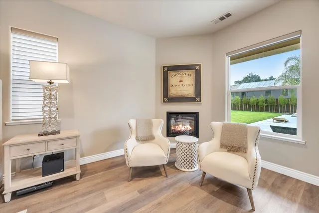 a bathroom with a granite countertop sink a toilet and a mirror