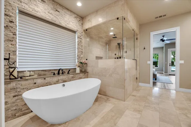 a bedroom with a large bed and a couch