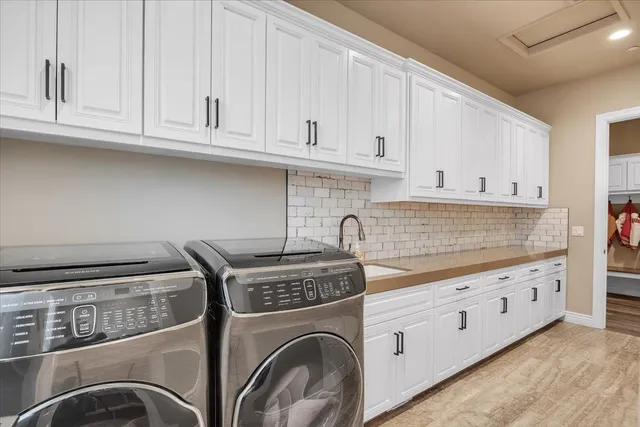 a kitchen with stainless steel appliances granite countertop a sink and a stove