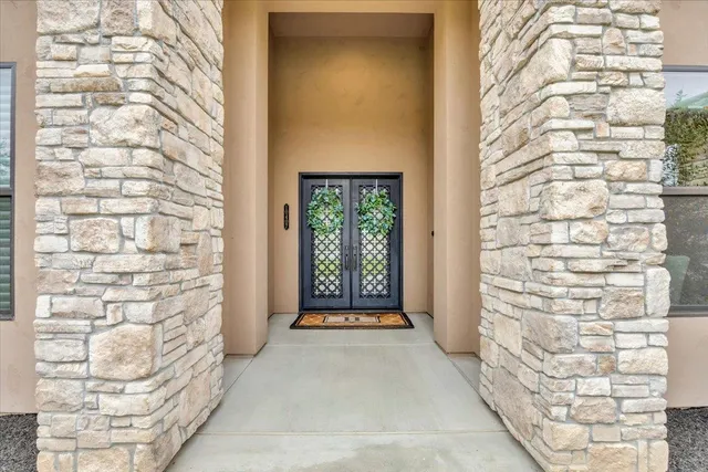 a living room with fireplace furniture and a wooden floor