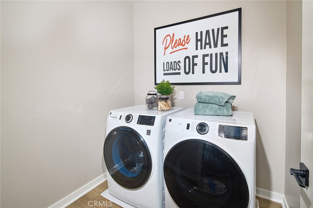 12706 Rosemount Road Eastvale, CA 92880 - Photo 11 of 25 a utility room with dryer and washer