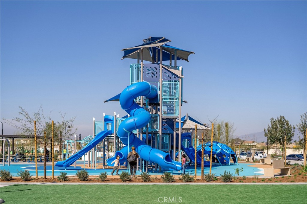 12706 Rosemount Road Eastvale, CA 92880 - Photo 16 of 25 a childrens park with lots of swings and slides