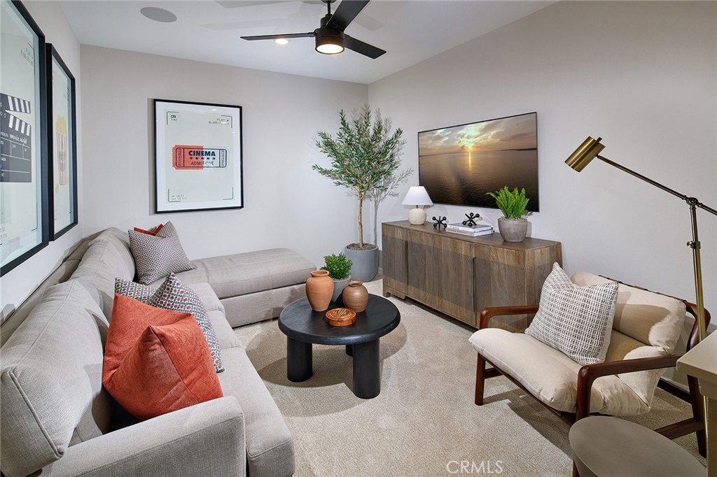 12706 Rosemount Road Eastvale, CA 92880 - Photo 6 of 25 a living room with furniture and a flat screen tv