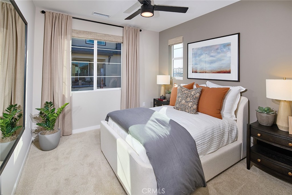 12706 Rosemount Road Eastvale, CA 92880 - Photo 7 of 25 a bedroom with a bed and a potted plant
