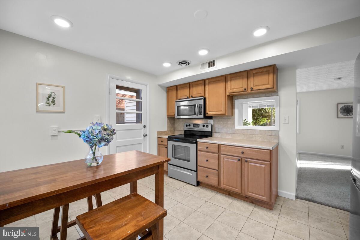 413 Waterford Road Silver Spring, MD 20901 - Photo 11 of 48 a kitchen with a sink cabinets and appliances