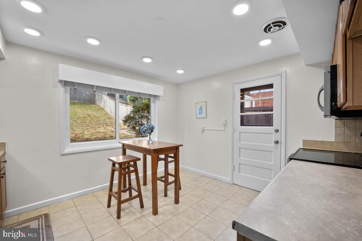 413 Waterford Road Silver Spring, MD 20901 - Photo 14 of 48 a view of a dining room with furniture window and outside view
