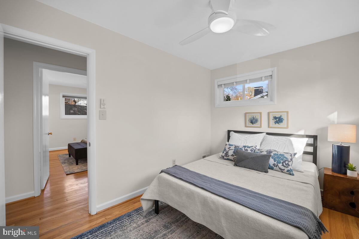 413 Waterford Road Silver Spring, MD 20901 - Photo 27 of 48 a bedroom with a bed and wooden floor