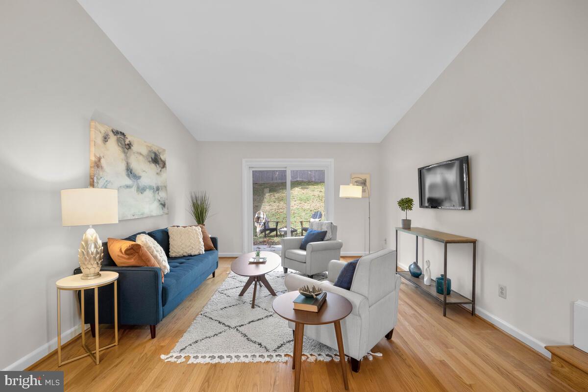 413 Waterford Road Silver Spring, MD 20901 - Photo 4 of 48 a living room with furniture wooden floor and a window