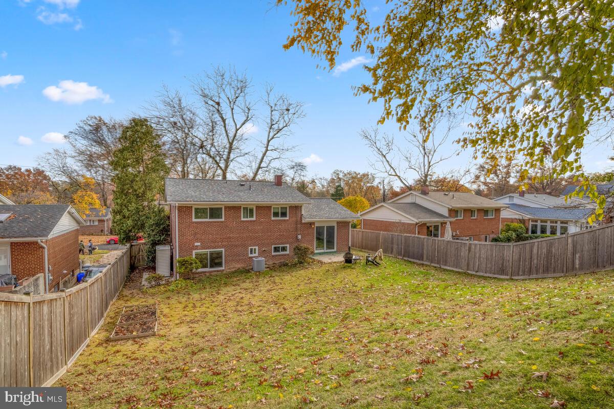 413 Waterford Road Silver Spring, MD 20901 - Photo 39 of 48 a view of a house with a yard covered with snow in front of house