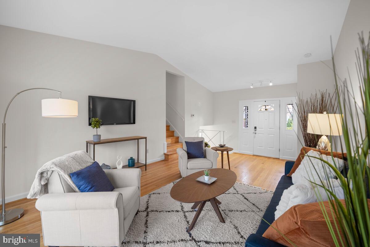 413 Waterford Road Silver Spring, MD 20901 - Photo 5 of 48 a living room with furniture and a flat screen tv