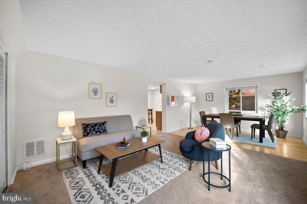 413 Waterford Road Silver Spring, MD 20901 - Photo 7 of 48 a living room with furniture and wooden floor