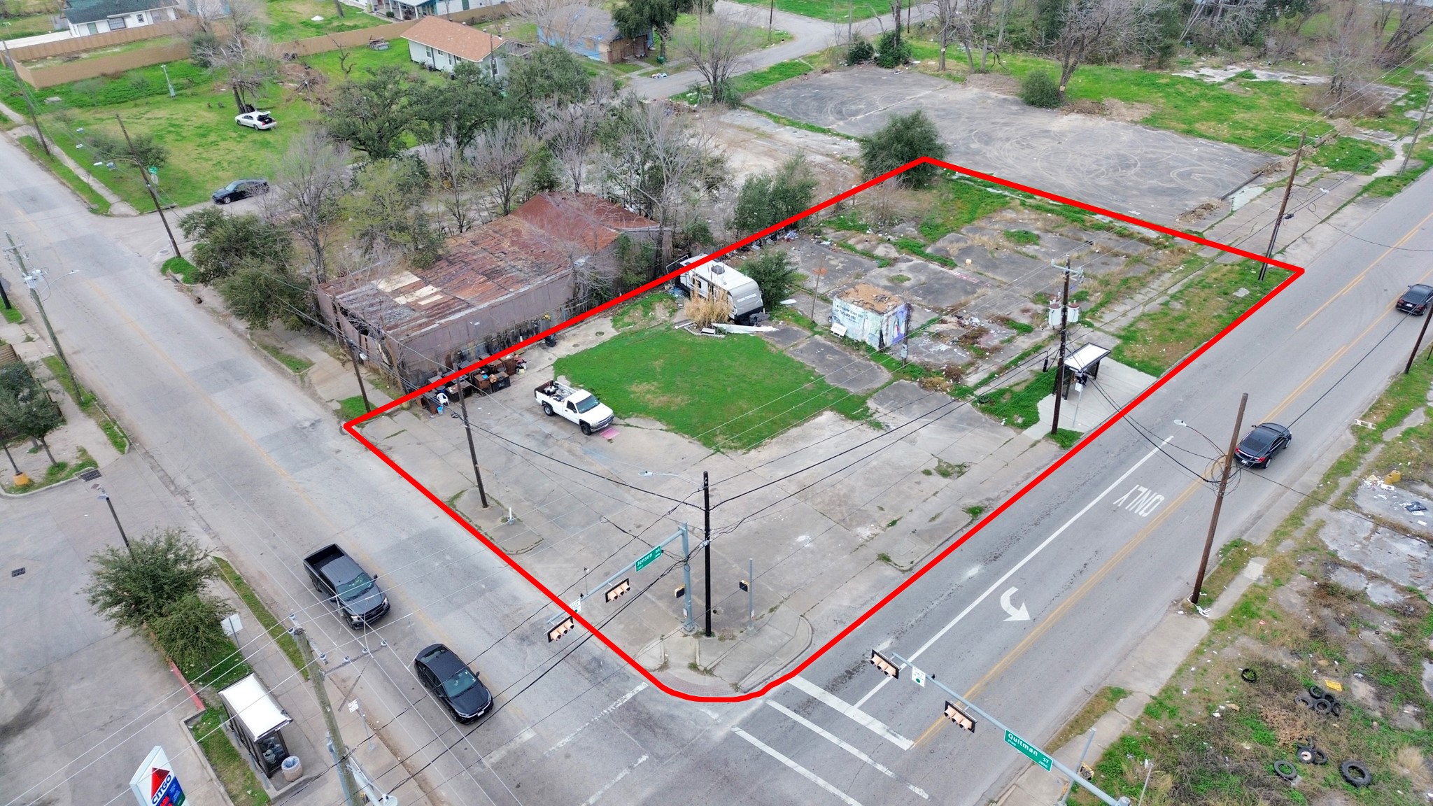 2401 Jensen Drive Houston, TX 77026 - Photo 2 of 22 a view of a tennis ground with large trees