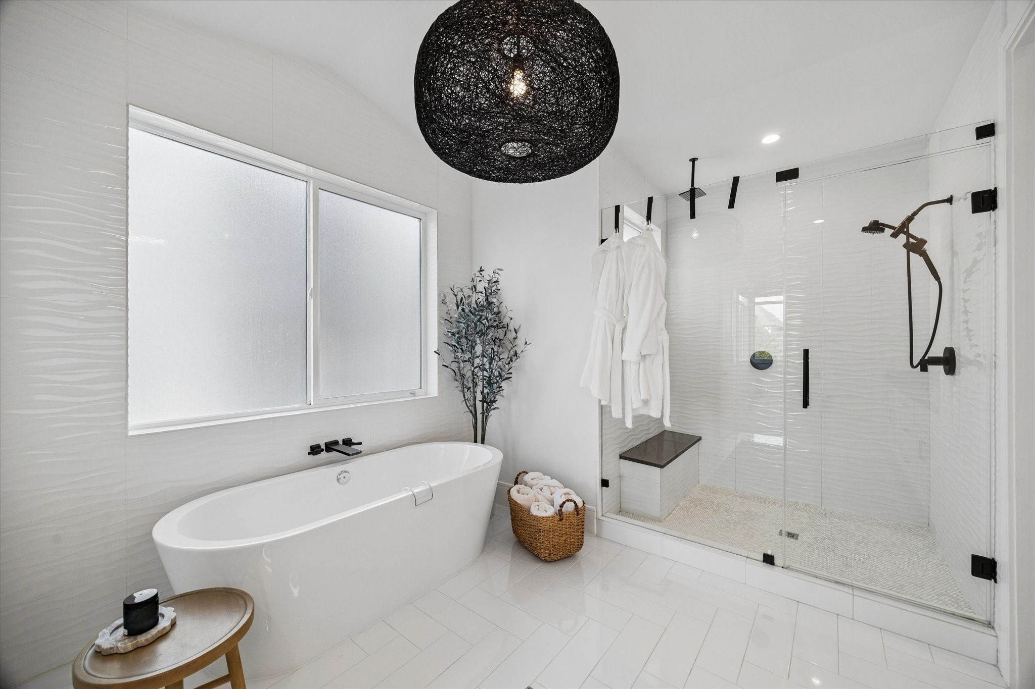 1661 Bingle Road Houston, TX 77055 - Photo 19 of 33 large soaking tub, Open Weave pendant lighting with bronze black finish. wave porcelain tiles.