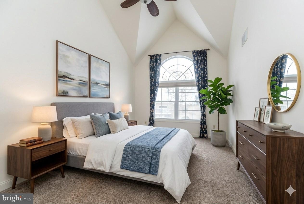 114 West Kennedy Road, Unit 189 North Wales, PA 19454 - Photo 17 of 43 a bedroom with a bed potted plant on dresser and a window