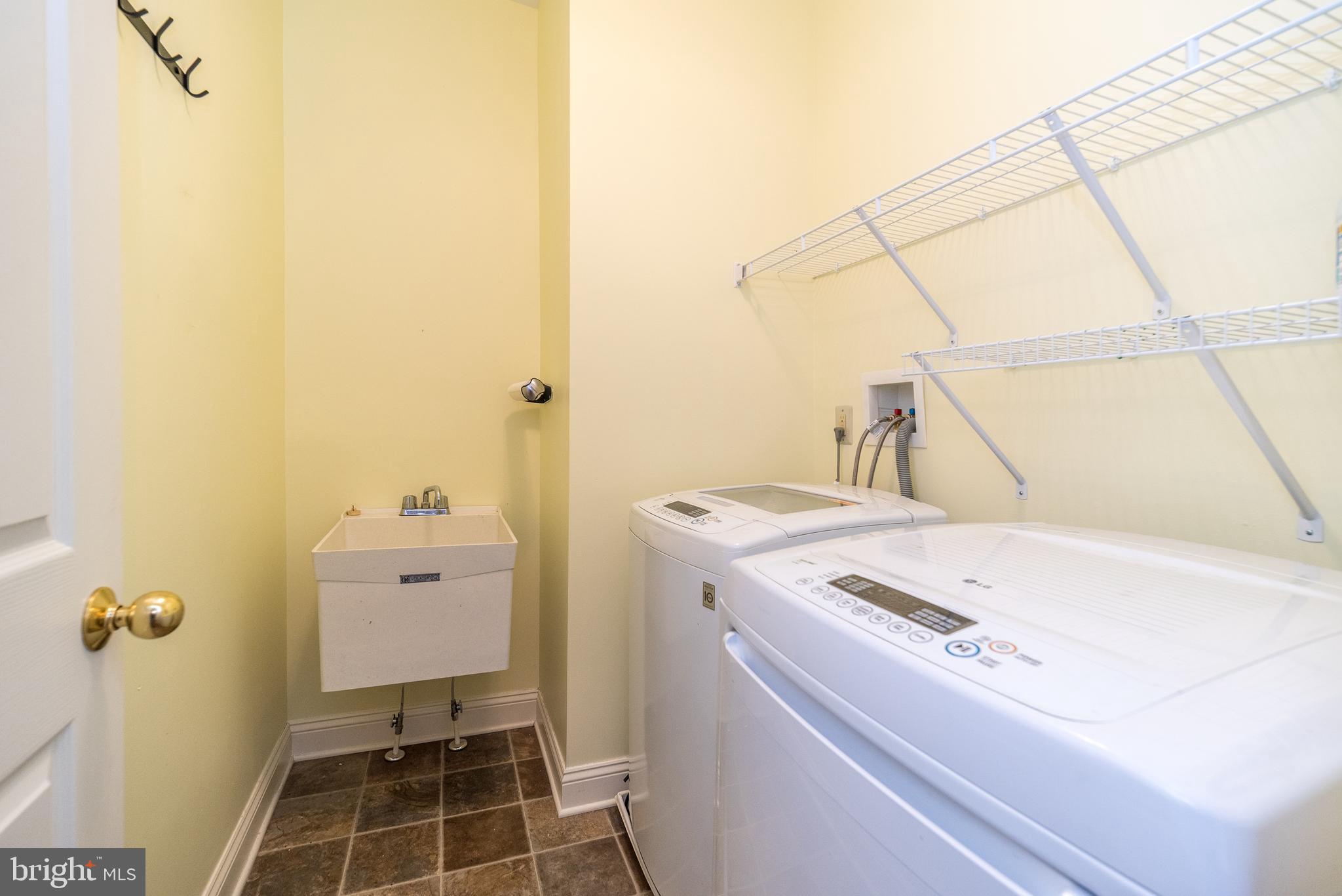 114 West Kennedy Road, Unit 189 North Wales, PA 19454 - Photo 21 of 43 a utility room with dryer and washer