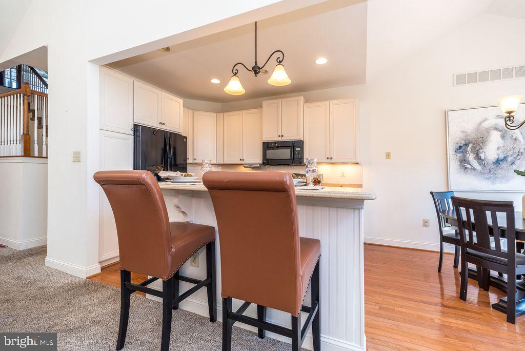 114 West Kennedy Road, Unit 189 North Wales, PA 19454 - Photo 6 of 43 a dining room with furniture and wooden floor