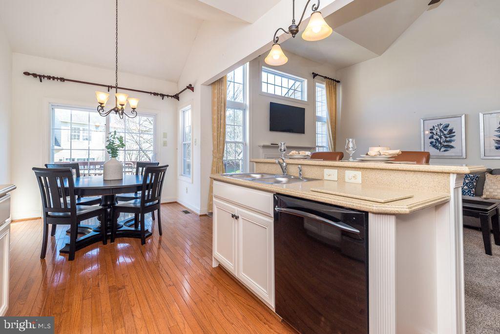 114 West Kennedy Road, Unit 189 North Wales, PA 19454 - Photo 7 of 43 a kitchen with a table chairs sink and cabinets