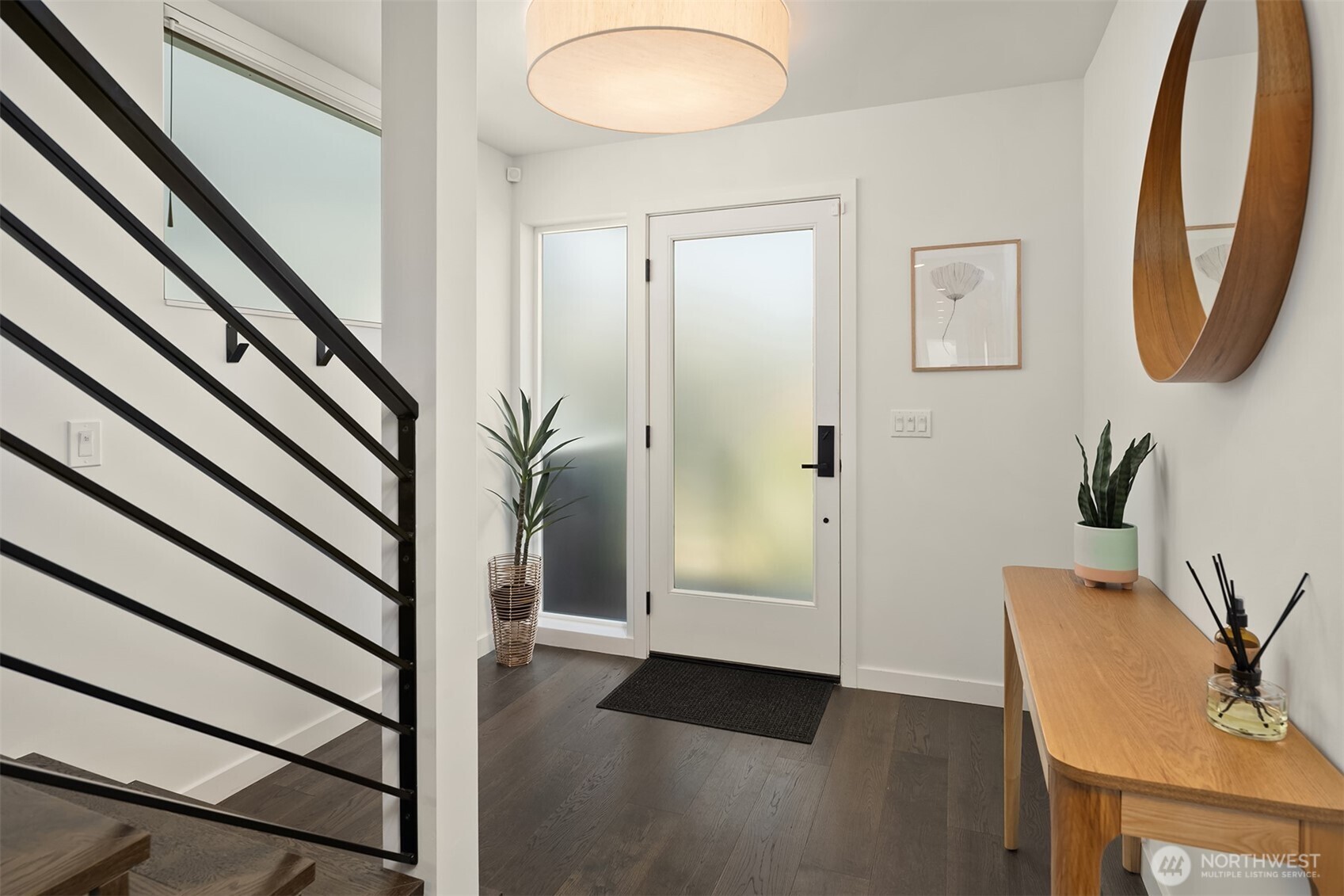 4005 Corliss Avenue North Seattle, WA 98103 - Photo 15 of 40 a view of an entryway with wooden floor