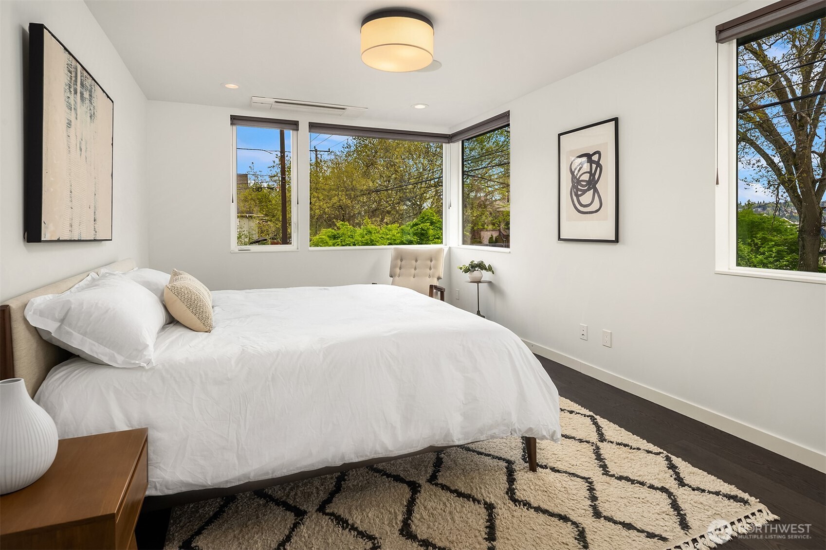 4005 Corliss Avenue North Seattle, WA 98103 - Photo 16 of 40 a spacious bedroom with a bed and a window