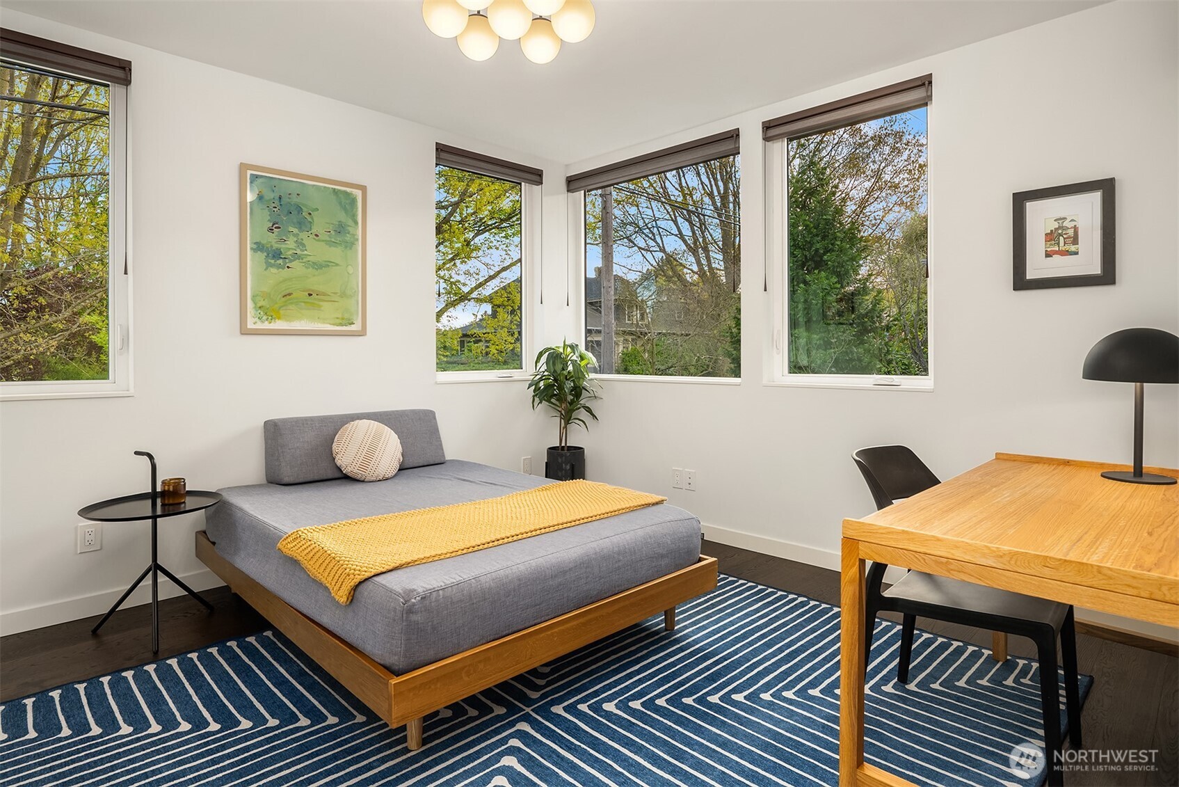 4005 Corliss Avenue North Seattle, WA 98103 - Photo 20 of 40 a bedroom with a bed and wooden floor