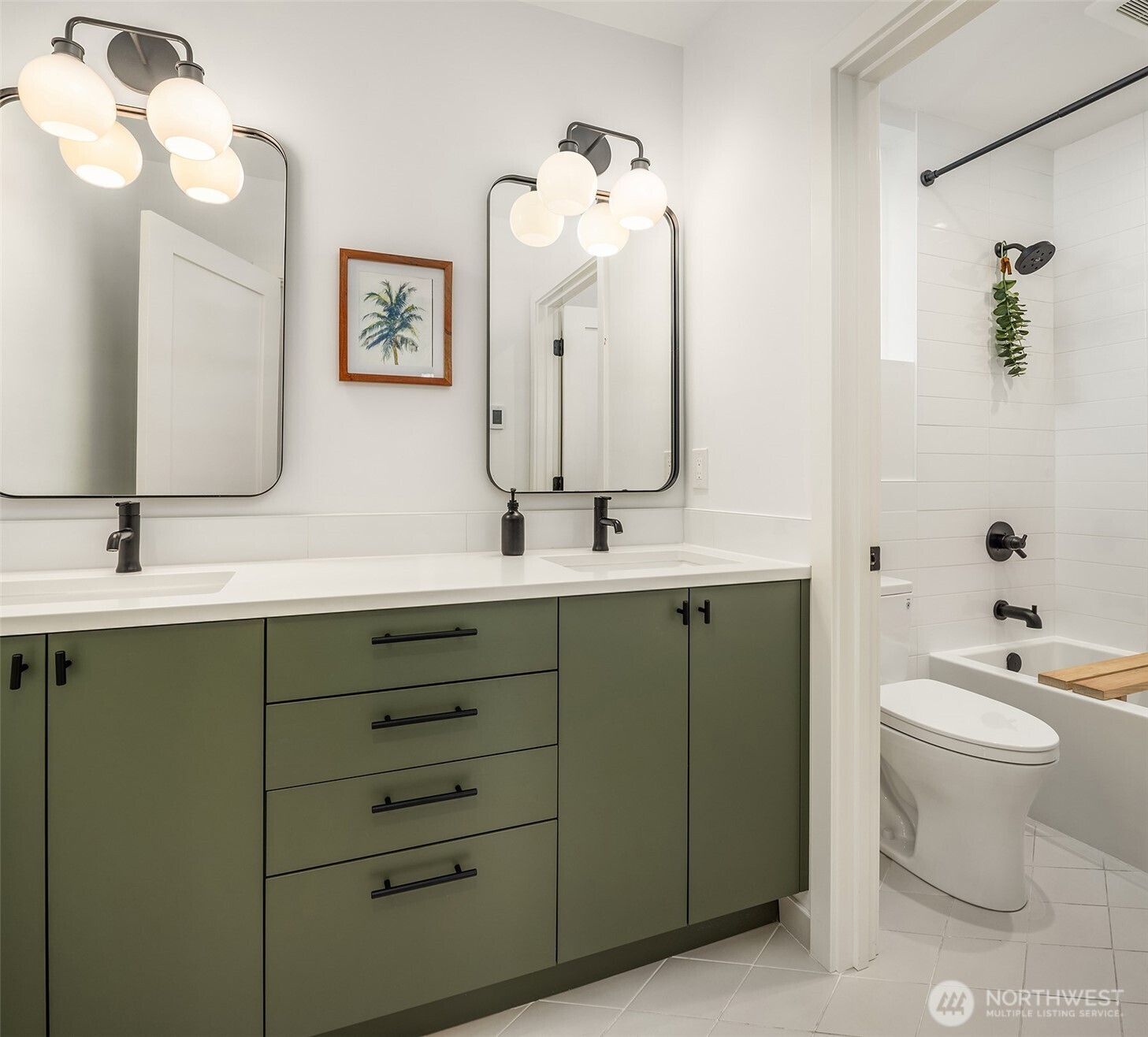 4005 Corliss Avenue North Seattle, WA 98103 - Photo 21 of 40 a bathroom with a double vanity sink and a mirror