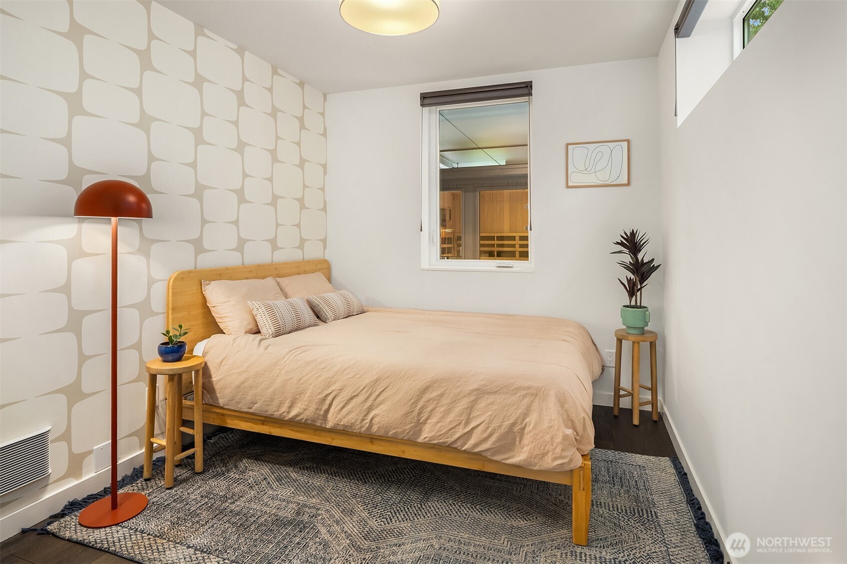 4005 Corliss Avenue North Seattle, WA 98103 - Photo 23 of 40 a bedroom with a bed and a lamp