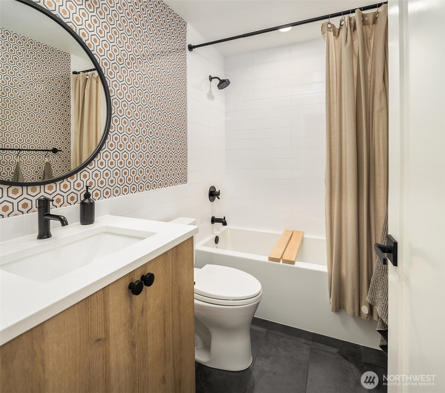 4005 Corliss Avenue North Seattle, WA 98103 - Photo 24 of 40 a bathroom with a sink a toilet and a mirror