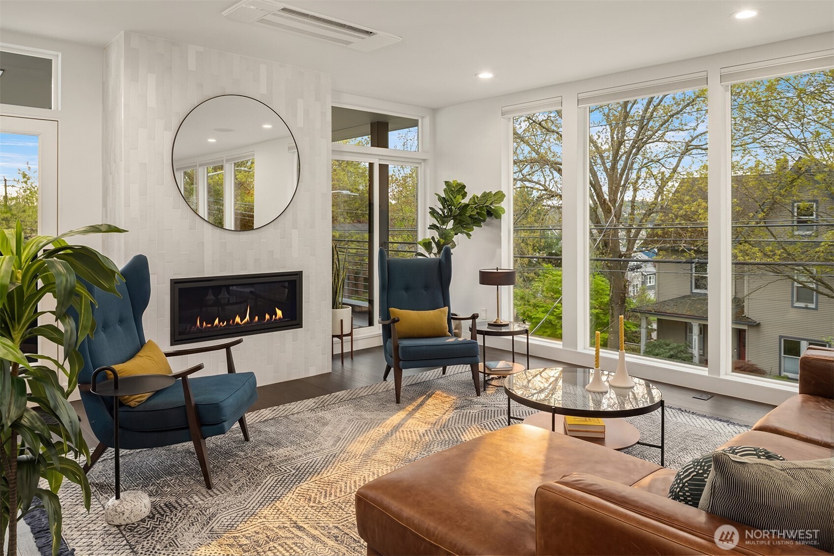 4005 Corliss Avenue North Seattle, WA 98103 - Photo 3 of 40 a living room with furniture a fireplace and a large window
