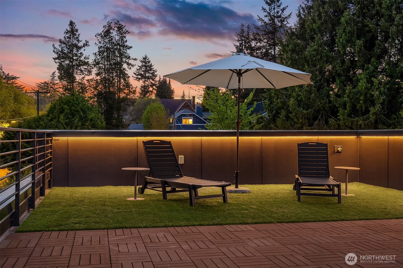 4005 Corliss Avenue North Seattle, WA 98103 - Photo 38 of 40 a view of a backyard with sitting area and hardwood floor