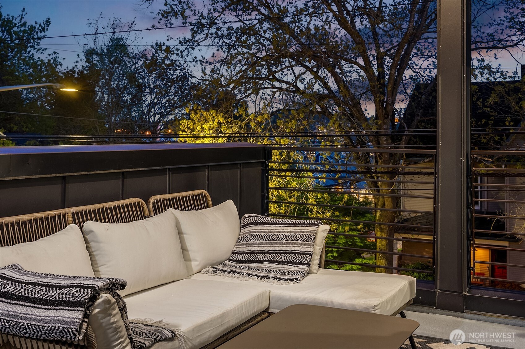 4005 Corliss Avenue North Seattle, WA 98103 - Photo 39 of 40 a roof deck view with tall trees