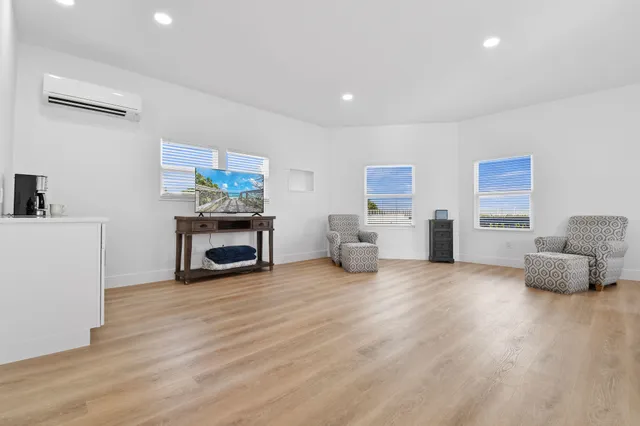 a bedroom with furniture and a window