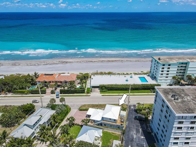 a view of a chair and fire pit in the backyard