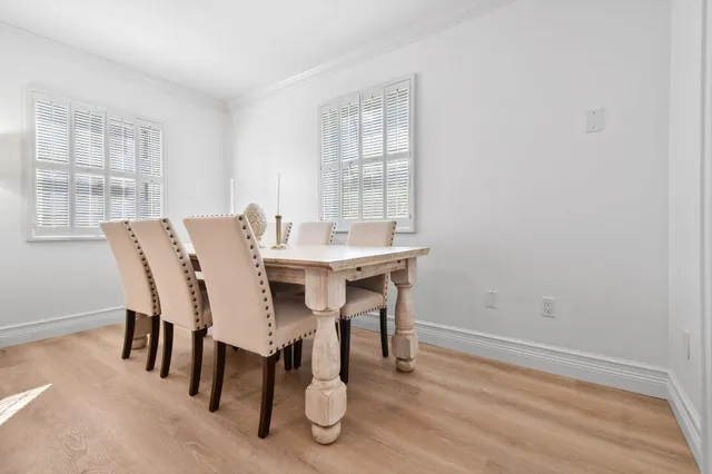 a view of a dining room with furniture and window