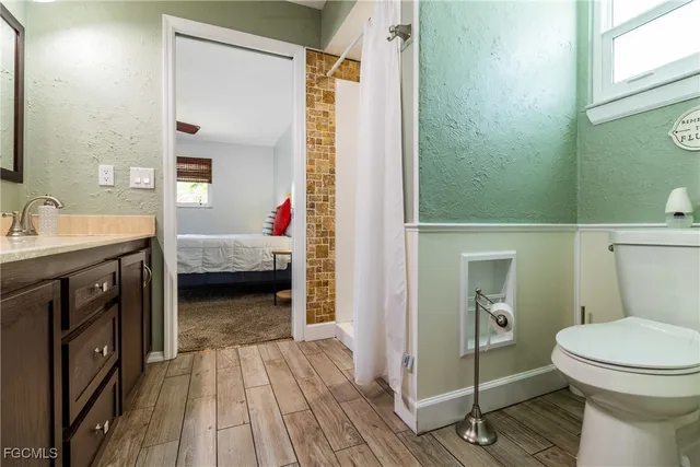 a bathroom with a shower and a toilet