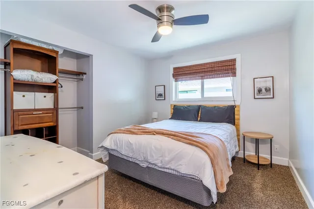 a bedroom with bed and window