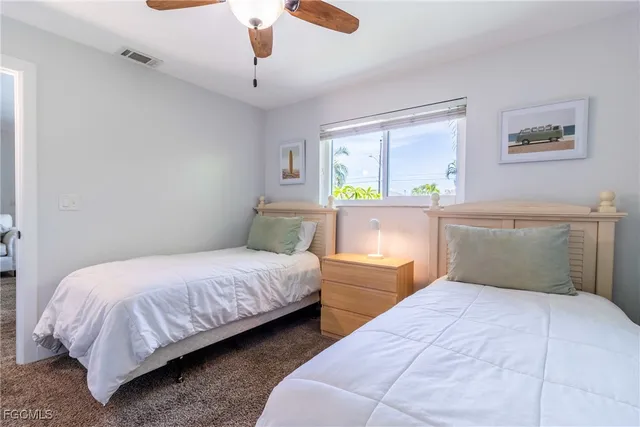a bathroom with a sink a toilet and shower curtain