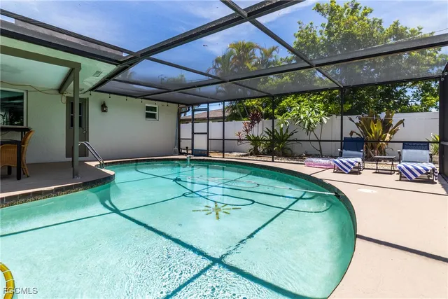 a view of a swimming pool with a patio