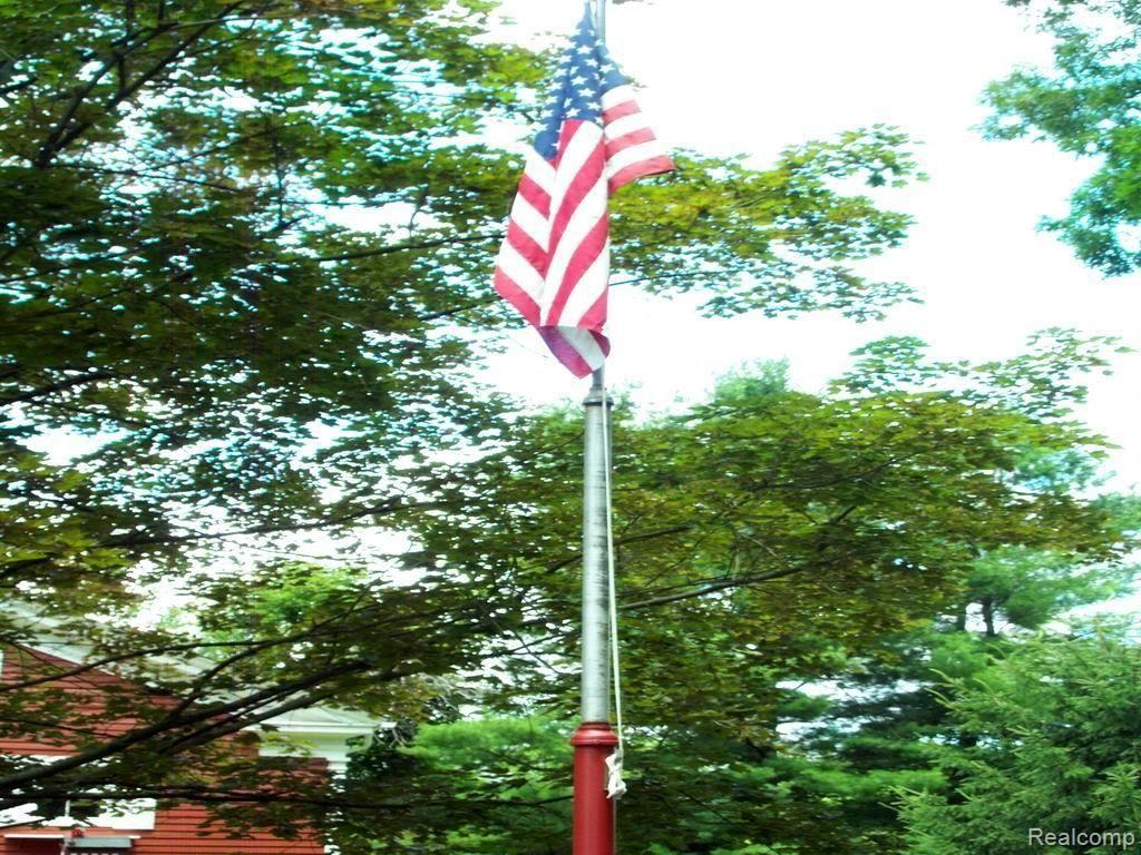 1480 Noble Road Leonard, MI 48367 - Photo 14 of 33 COMPLETE WITH FLAG POLE IN FRONT YARD