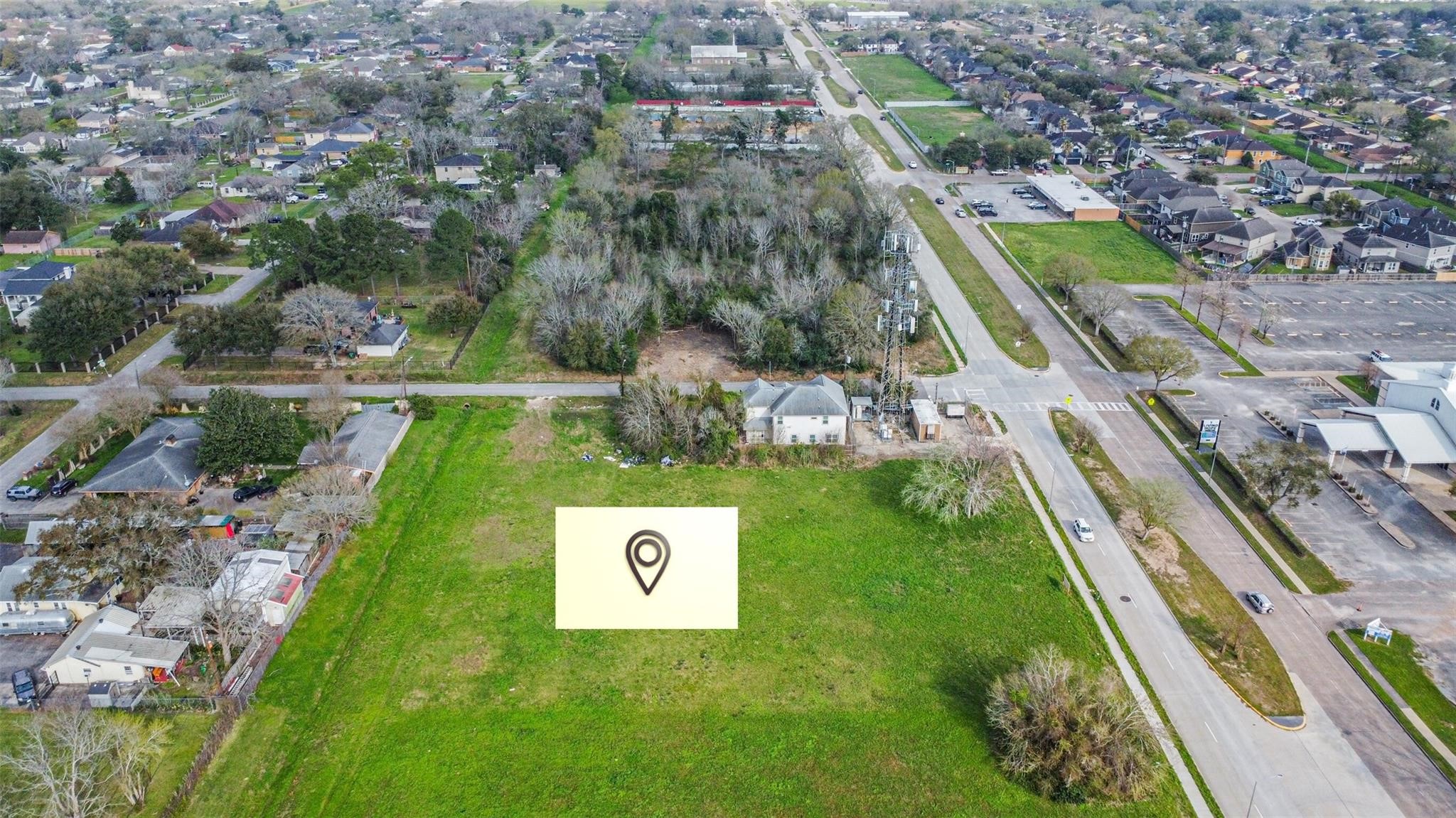 a view of a back yard with a wooden fence