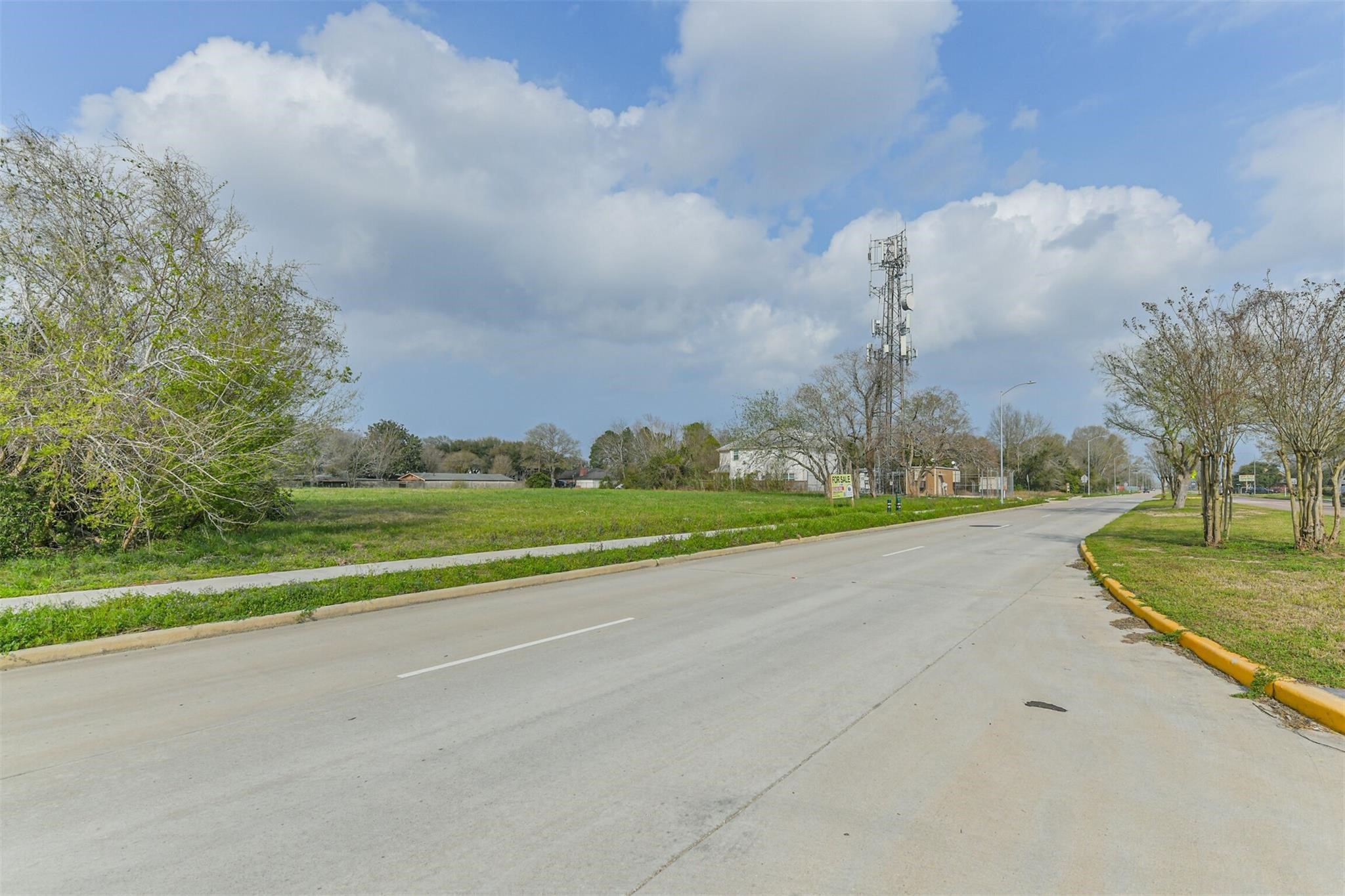 Tbd Fuqua Street Houston, TX 77075 - Photo 4 of 11 a view of a house with a big yard and large trees
