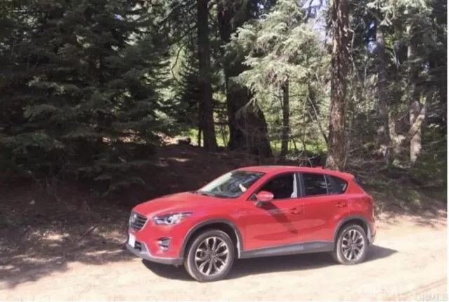 a front view of a house with car parked