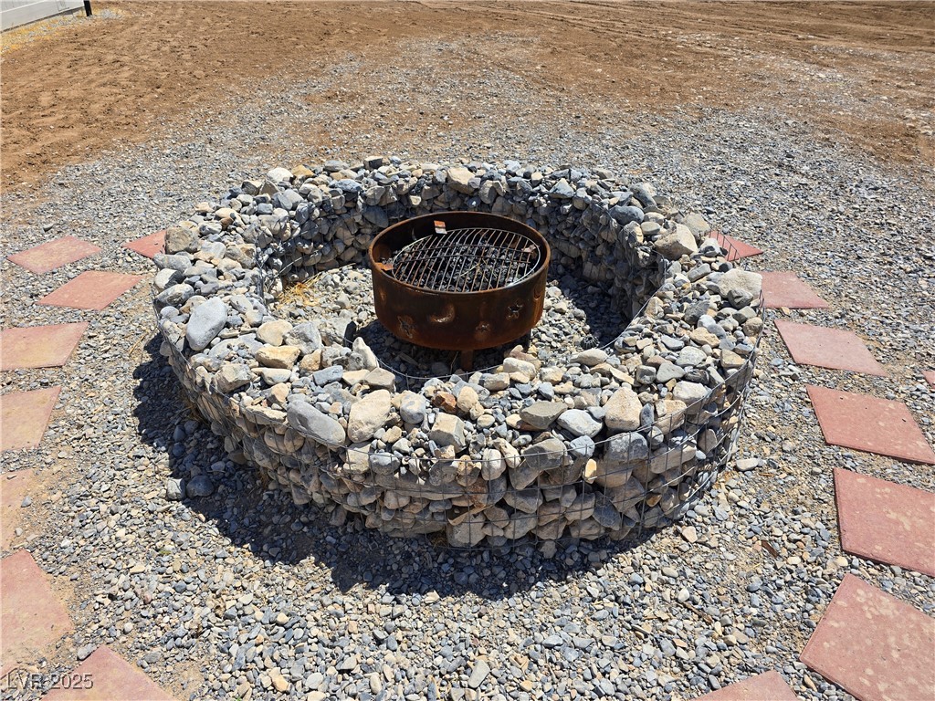 330 Gilmore Road Pahrump, NV 89060 - Photo 30 of 42 Large stone firepit.